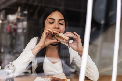 Woman Eating Sandwicj