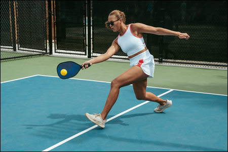 Woman playing pickleball
